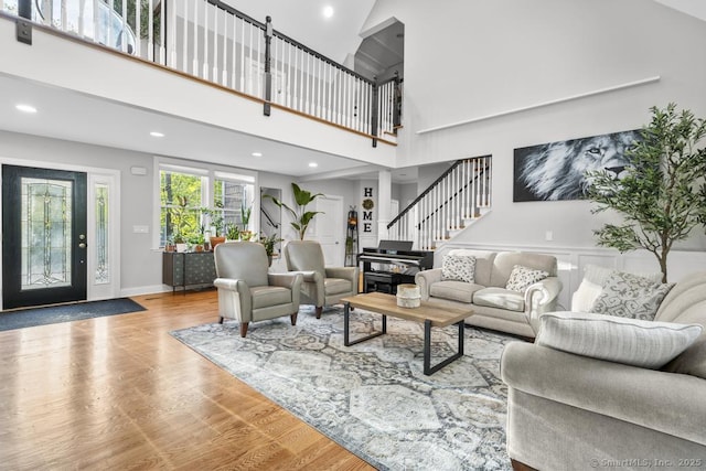 308 Old Zoar Rd, Monroe, CT 06468 - living area with wood finished floors, stairway, recessed lighting, and a towering ceiling