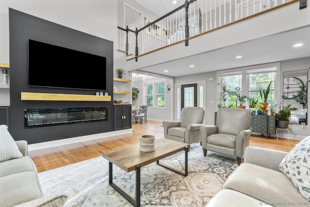 308 Old Zoar Rd, Monroe, CT 06468 - living room with wood finished floors, plenty of natural light, recessed lighting, baseboards, and a towering ceiling