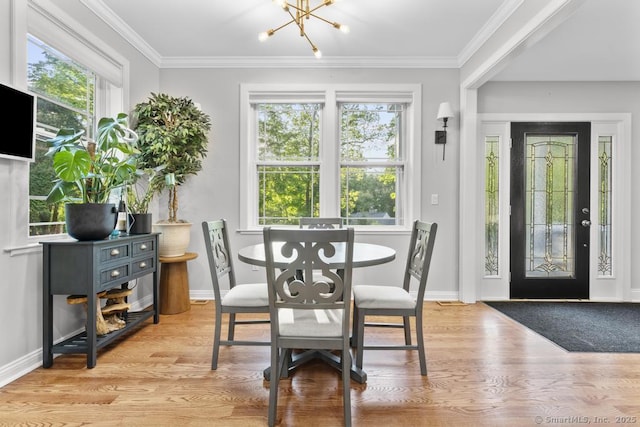 308 Old Zoar Rd, Monroe, CT 06468 - dining area featuring a chandelier, plenty of natural light, wood finished floors, baseboards, and ornamental molding