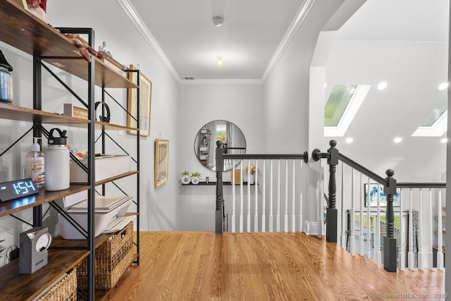 308 Old Zoar Rd, Monroe, CT 06468 - hall featuring a skylight, wood finished floors, crown molding, and recessed lighting