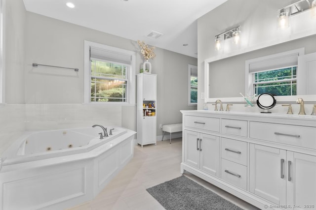 308 Old Zoar Rd, Monroe, CT 06468 - full bath with double vanity, a jetted tub, and baseboards