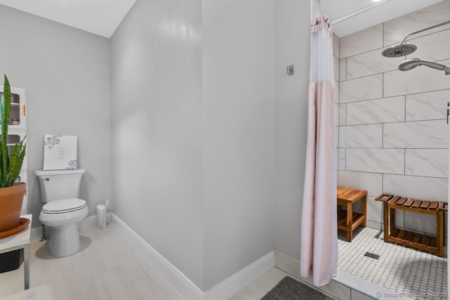 308 Old Zoar Rd, Monroe, CT 06468 - bathroom with toilet, a tile shower, and baseboards