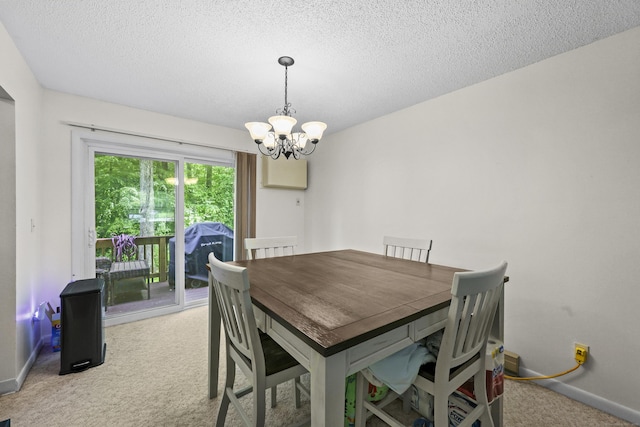 745 Merrow Rd Apt 171, Coventry, CT 06238 - dining room with light carpet, a chandelier, baseboards, and a textured ceiling