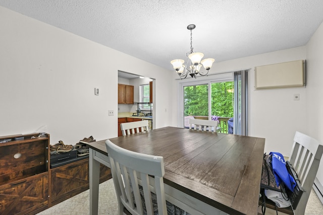 745 Merrow Rd Apt 171, Coventry, CT 06238 - dining room featuring a chandelier and a textured ceiling