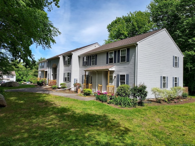 745 Merrow Rd Apt 171, Coventry, CT 06238 - view of front of property with a front lawn and covered porch