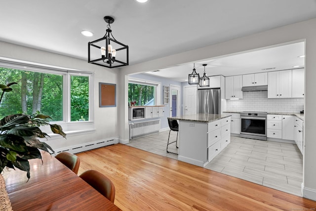 401 Russell Ave, Suffield, CT 06078 - kitchen with freestanding refrigerator, a chandelier, radiator heating unit, a baseboard heating unit, and recessed lighting