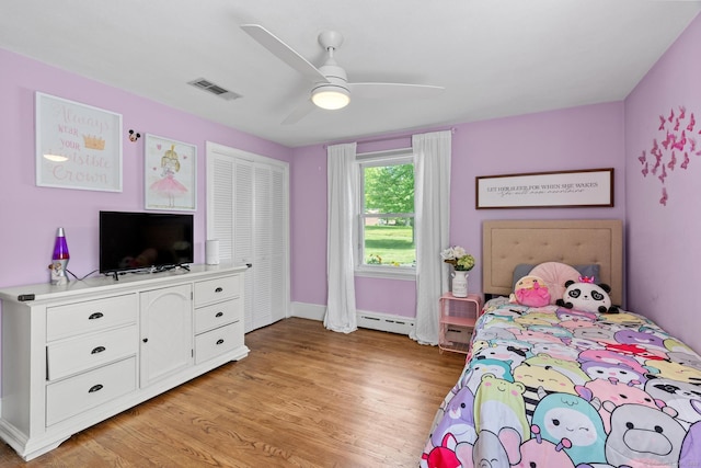 401 Russell Ave, Suffield, CT 06078 - bedroom featuring baseboard heating, light wood-type flooring, baseboards, and a ceiling fan