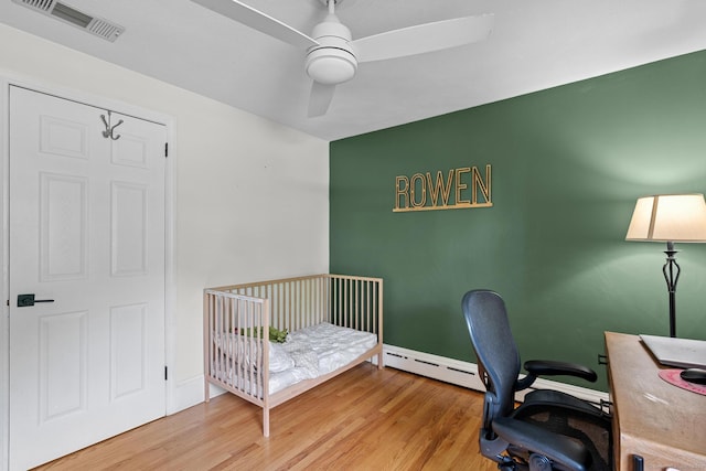 401 Russell Ave, Suffield, CT 06078 - bedroom featuring a desk, wood finished floors, baseboards, and a ceiling fan