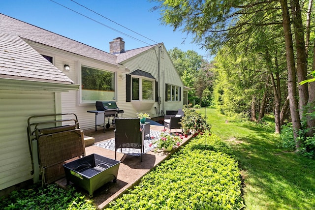 401 Russell Ave, Suffield, CT 06078 - view of green lawn with a patio and an outdoor living space