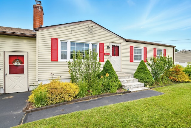 47 Varno Ln, Enfield, CT 06082 - view of front of home with a front lawn and a chimney