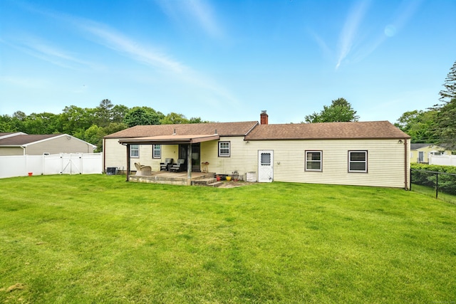47 Varno Ln, Enfield, CT 06082 - rear view of house with a patio, a chimney, and a gate