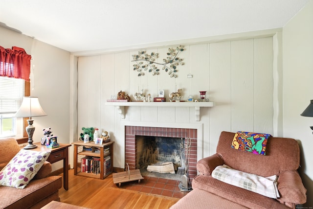 47 Varno Ln, Enfield, CT 06082 - living area featuring wood finished floors and a brick fireplace
