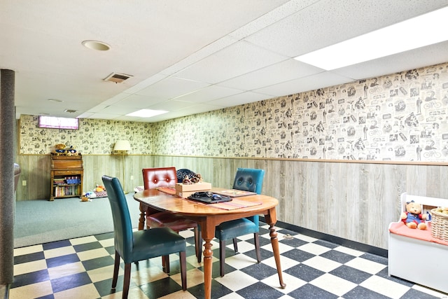 47 Varno Ln, Enfield, CT 06082 - dining room with tile patterned floors, a drop ceiling, a wainscoted wall, wallpapered walls, and wood walls