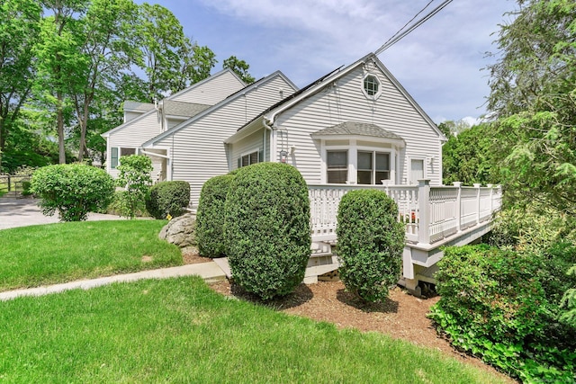 50 Harrison Ave, New Canaan, CT 06840 - view of front of property with a deck and a front yard