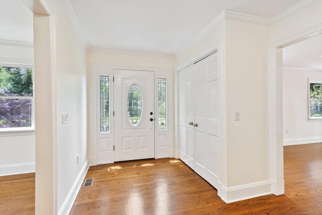 50 Harrison Ave, New Canaan, CT 06840 - foyer entrance featuring light wood-style flooring, crown molding, and baseboards