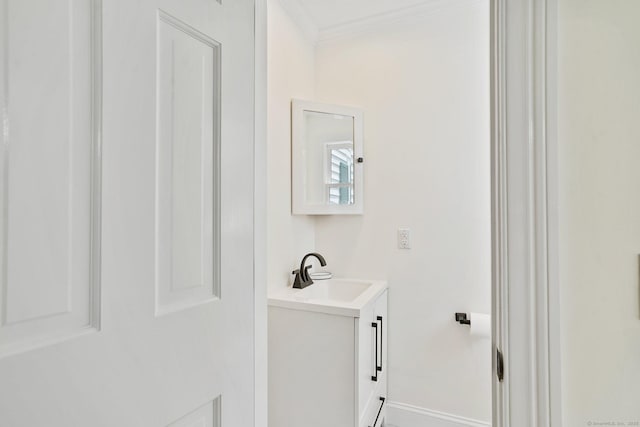50 Harrison Ave, New Canaan, CT 06840 - bathroom with vanity, ornamental molding, and baseboards