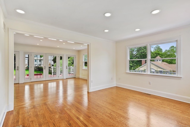50 Harrison Ave, New Canaan, CT 06840 - unfurnished room featuring ornamental molding, recessed lighting, baseboards, light wood-style floors, and french doors