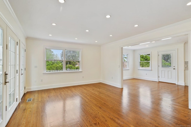 50 Harrison Ave, New Canaan, CT 06840 - foyer entrance with crown molding, plenty of natural light, light wood-style flooring, baseboards, and recessed lighting