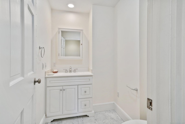 50 Harrison Ave, New Canaan, CT 06840 - half bath featuring vanity, baseboards, and marble finish floors