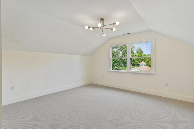 50 Harrison Ave, New Canaan, CT 06840 - additional living space with light colored carpet, lofted ceiling, a chandelier, and baseboards