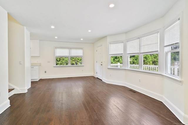 50 Harrison Ave, New Canaan, CT 06840 - unfurnished living room featuring baseboards, dark wood-style floors, and recessed lighting