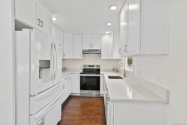 50 Harrison Ave, New Canaan, CT 06840 - kitchen with white fridge with ice dispenser, stainless steel electric stove, under cabinet range hood, a sink, and white cabinets