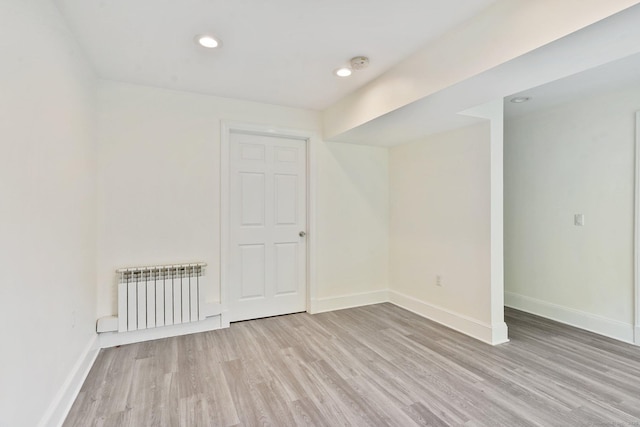 50 Harrison Ave, New Canaan, CT 06840 - spare room with radiator heating unit, light wood-style flooring, baseboards, recessed lighting, and a smoke detector