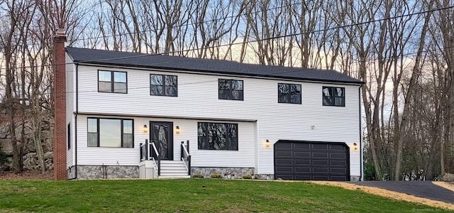 627 High Ridge Rd, Orange, CT 06477 - view of front facade featuring an attached garage, a chimney, a front yard, and driveway