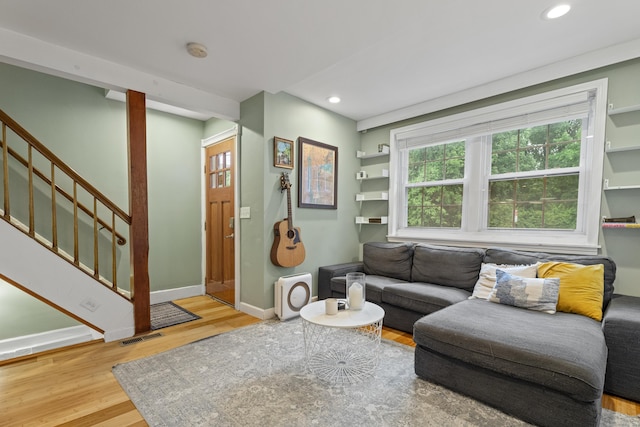 128 Mill River St, New Haven, CT 06511 - living area with wood finished floors, baseboards, stairs, and recessed lighting