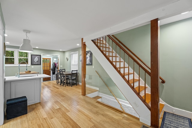 128 Mill River St, New Haven, CT 06511 - stairway with wood finished floors, recessed lighting, and baseboards