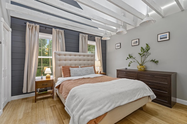 128 Mill River St, New Haven, CT 06511 - bedroom featuring light wood-type flooring, multiple windows, beamed ceiling, and baseboards