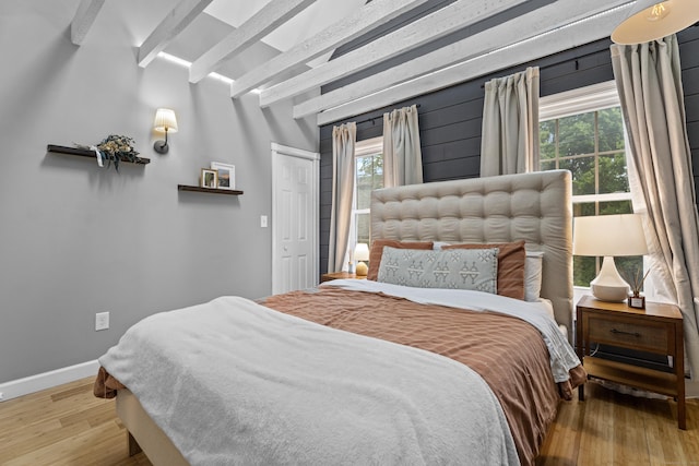 128 Mill River St, New Haven, CT 06511 - bedroom featuring beam ceiling, wood finished floors, baseboards, and a closet