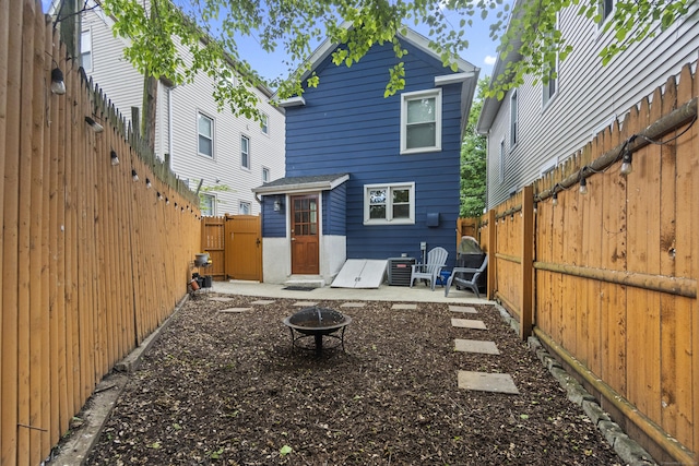 128 Mill River St, New Haven, CT 06511 - rear view of house with an outdoor fire pit, a fenced backyard, a patio area, and a gate