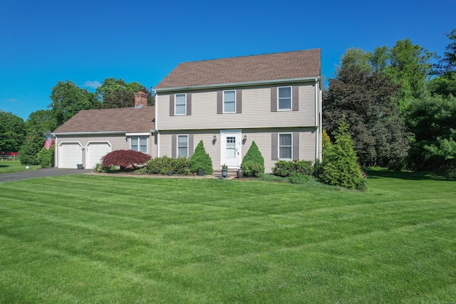 5 Smith Pl, Cheshire, CT 06410 - colonial inspired home featuring an attached garage, asphalt driveway, a front lawn, and entry steps
