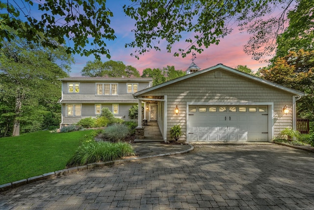 40 Thunder Hill Ln, Ridgefield, CT 06877 - view of front of house featuring decorative driveway, a yard, and a garage