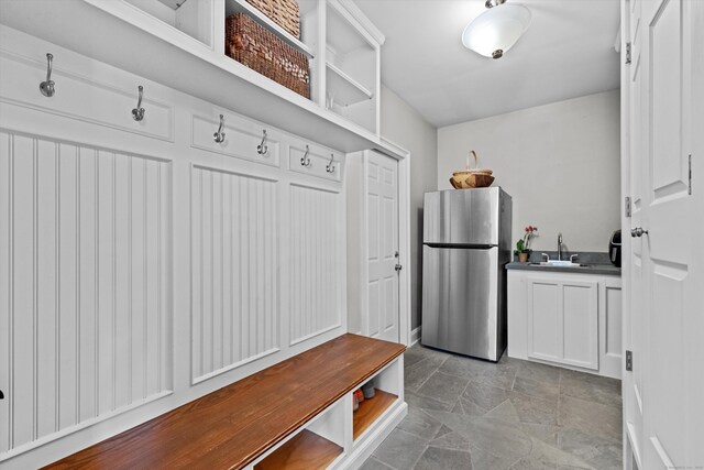 40 Thunder Hill Ln, Ridgefield, CT 06877 - mudroom featuring a sink and light stone finish floors