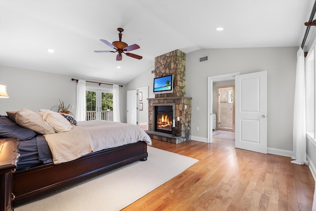 40 Thunder Hill Ln, Ridgefield, CT 06877 - bedroom featuring lofted ceiling, access to outside, light wood-style flooring, a stone fireplace, and baseboards