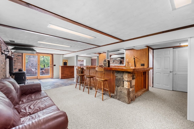 40 Thunder Hill Ln, Ridgefield, CT 06877 - indoor dry bar with a wood stove and light stone finish floors