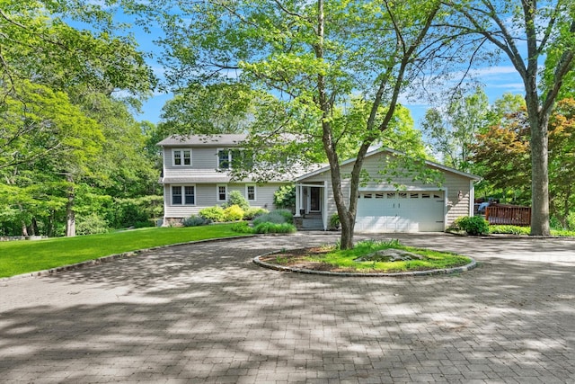 40 Thunder Hill Ln, Ridgefield, CT 06877 - view of front of house featuring a garage, decorative driveway, and a front yard