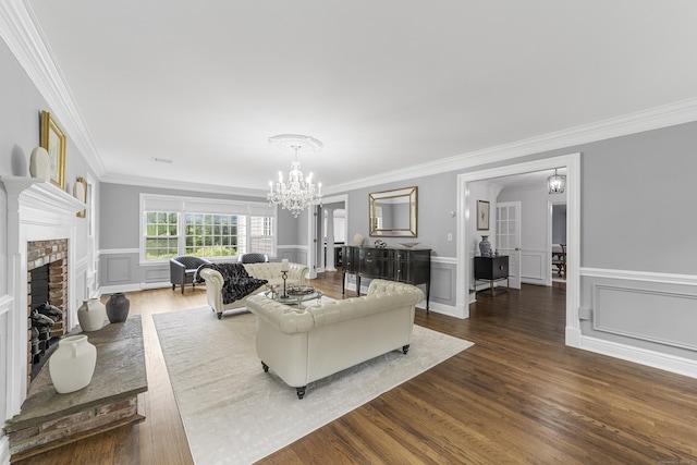 47 Ridgecrest Rd, Stamford, CT 06903 - living area with ornamental molding, a chandelier, dark wood-style floors, a brick fireplace, and a wainscoted wall