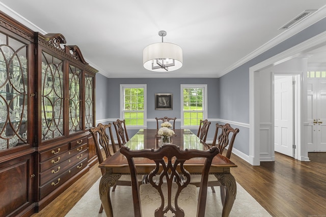 47 Ridgecrest Rd, Stamford, CT 06903 - dining room featuring dark wood-type flooring, ornamental molding, and baseboards