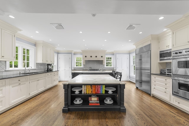 47 Ridgecrest Rd, Stamford, CT 06903 - kitchen featuring stainless steel appliances, open shelves, decorative backsplash, ornamental molding, and healthy amount of natural light