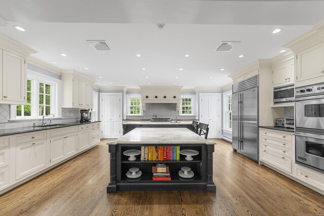 47 Ridgecrest Rd, Stamford, CT 06903 - kitchen with appliances with stainless steel finishes, open shelves, tasteful backsplash, ornamental molding, and healthy amount of natural light
