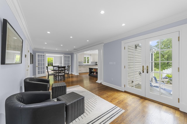 47 Ridgecrest Rd, Stamford, CT 06903 - living area with french doors, ornamental molding, wood finished floors, recessed lighting, and baseboards