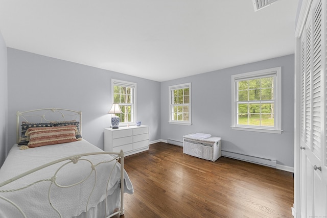 47 Ridgecrest Rd, Stamford, CT 06903 - bedroom with baseboard heating, wood finished floors, and baseboards