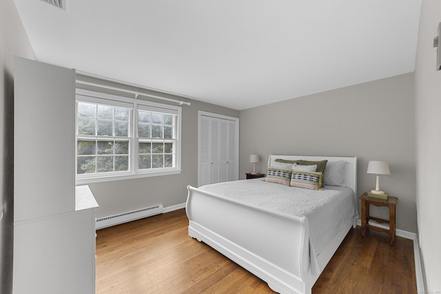 47 Ridgecrest Rd, Stamford, CT 06903 - bedroom with a baseboard radiator, wood finished floors, a closet, and baseboards