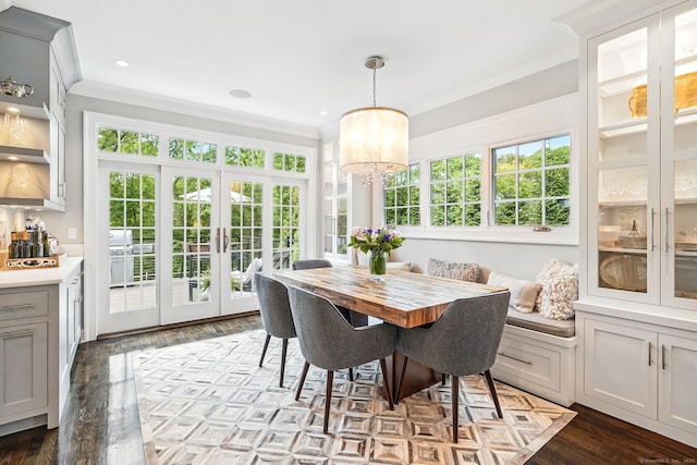 975 Flintlock Rd, Fairfield, CT 06890 - dining area with crown molding, a chandelier, french doors, and wood finished floors