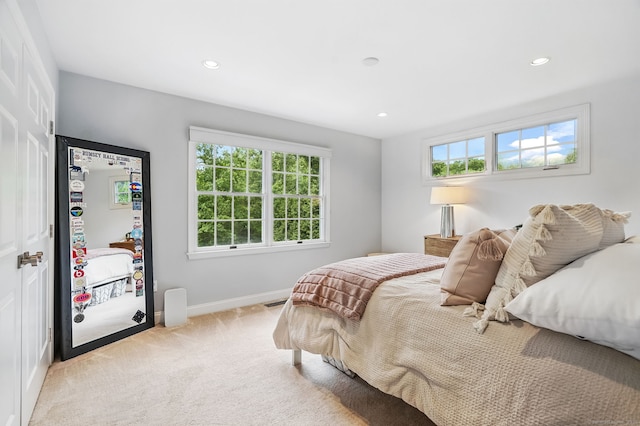 975 Flintlock Rd, Fairfield, CT 06890 - bedroom with multiple windows, light carpet, recessed lighting, and baseboards