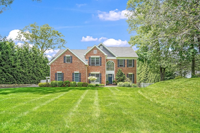 975 Flintlock Rd, Fairfield, CT 06890 - view of front of home featuring brick siding and a front lawn