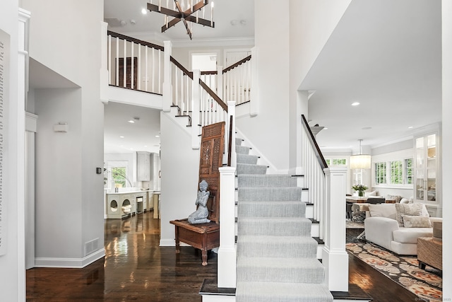 975 Flintlock Rd, Fairfield, CT 06890 - stairs featuring plenty of natural light, wood finished floors, a chandelier, recessed lighting, and a towering ceiling
